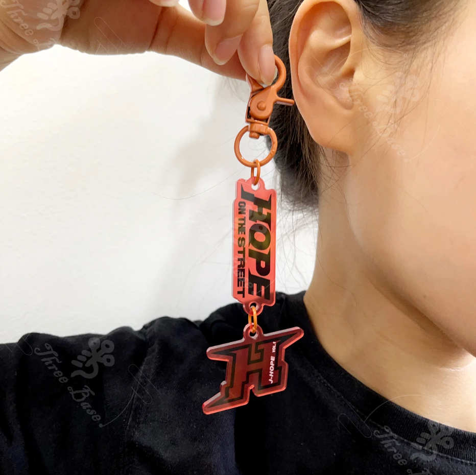 Tsuvishop Our BTS Jhope OnTheStreet Keychain! A perfect pendant accessory for your bag, mobile, or phone, made from high-quality acrylic. Color decorative piece inspired by Hobi's unique style.